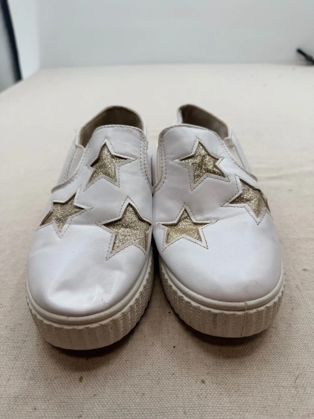 ' White Slip-On Sneakers with Gold Star Accents